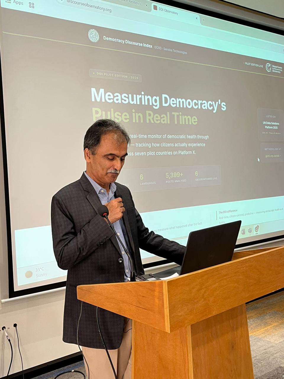 A speaker presenting the live Discourse Observatory at NED University, Pakistan